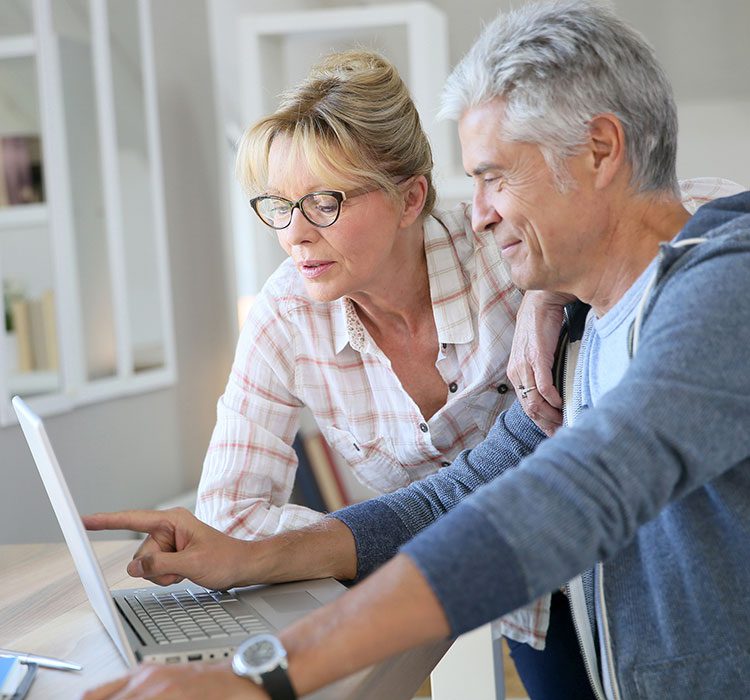 bigstock-Senior-couple-at-home-checking-102394388